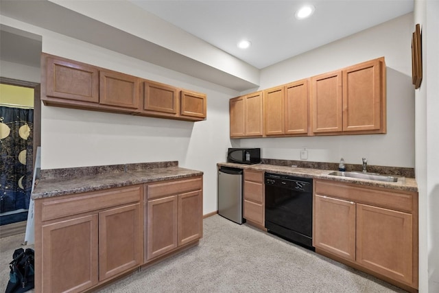 kitchen with light colored carpet, black appliances, and sink