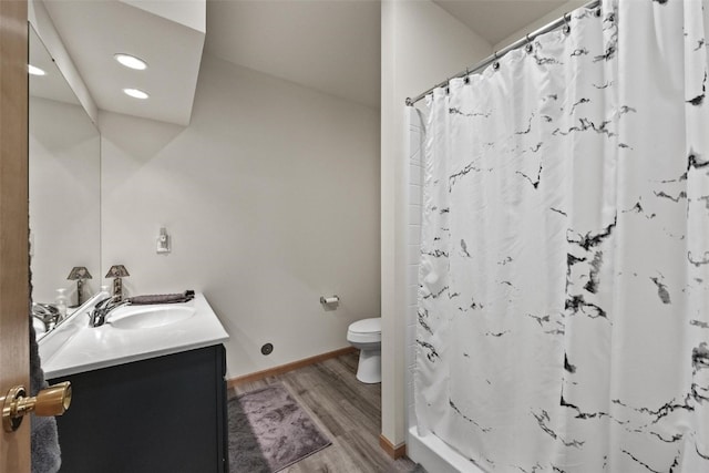 bathroom with vanity, a shower with shower curtain, wood-type flooring, and toilet