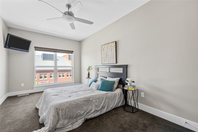 bedroom featuring dark colored carpet and ceiling fan