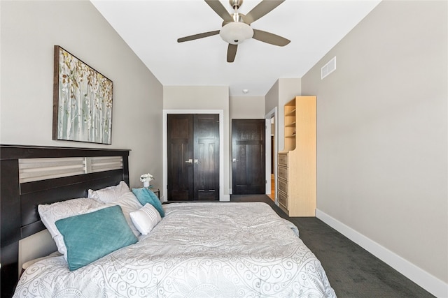 bedroom featuring a closet, ceiling fan, and dark colored carpet