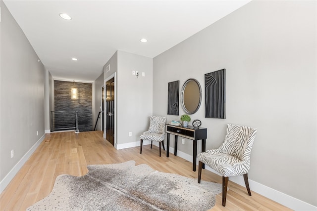 sitting room featuring light wood-type flooring