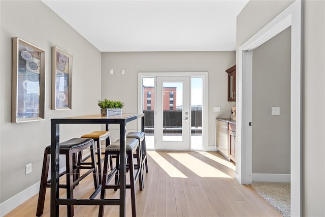 dining area featuring light wood-type flooring