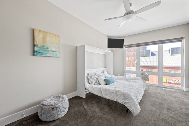 bedroom with ceiling fan and dark carpet