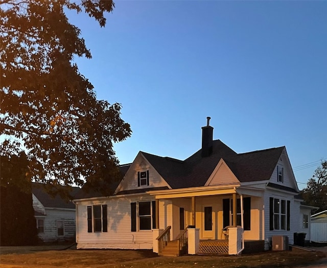 view of front of home with central AC and covered porch