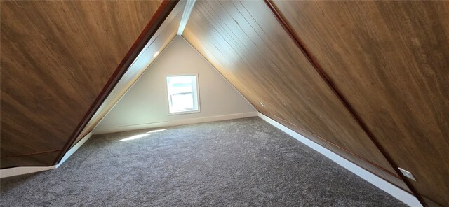 bonus room with lofted ceiling, carpet, and wood ceiling