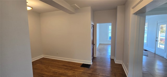 hallway featuring dark wood-type flooring