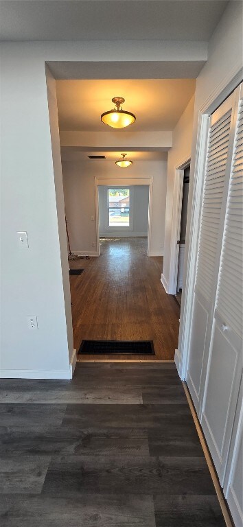 hall featuring dark wood-type flooring