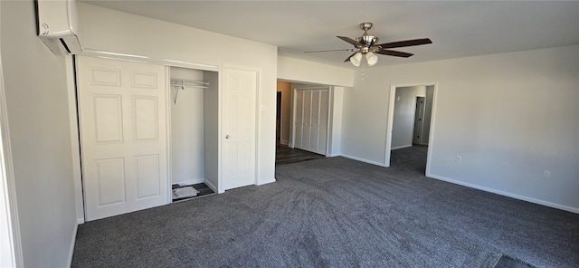 unfurnished bedroom featuring dark colored carpet, a closet, and ceiling fan