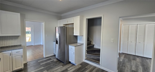 kitchen with backsplash, stainless steel refrigerator with ice dispenser, dark hardwood / wood-style flooring, and white cabinets