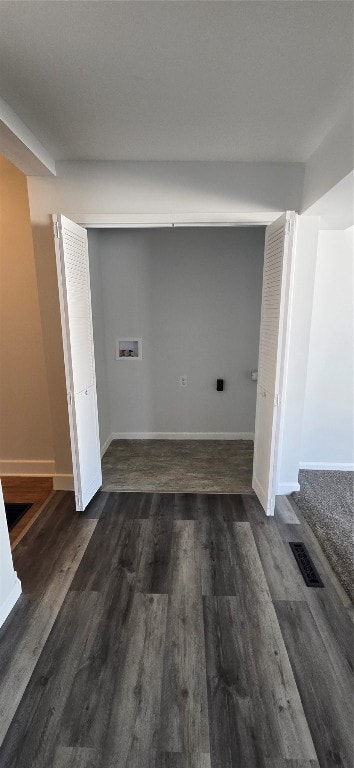 laundry area featuring dark wood-type flooring and hookup for a washing machine