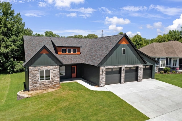 view of front of home featuring a front yard and a garage