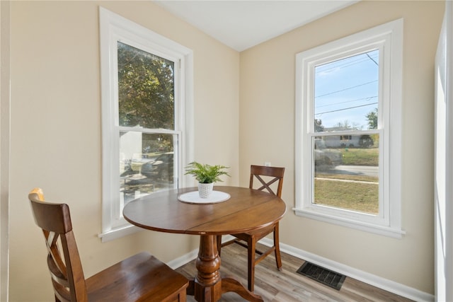 dining area with light hardwood / wood-style flooring