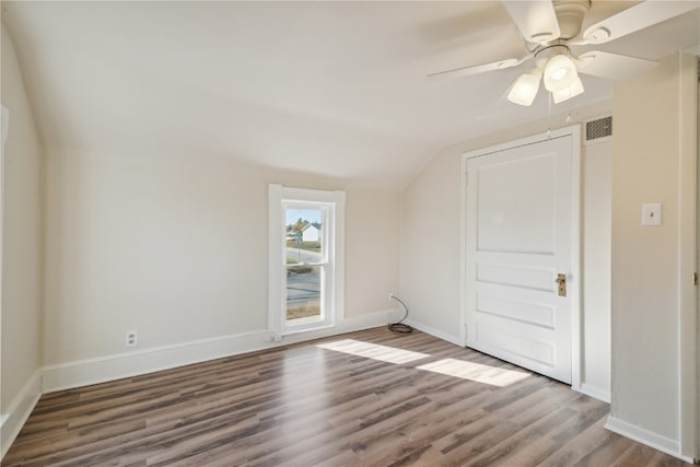 interior space featuring ceiling fan, wood-type flooring, and lofted ceiling