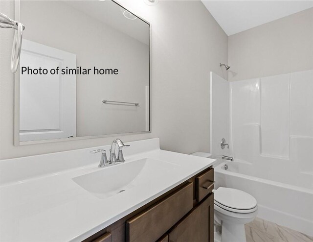 full bathroom featuring toilet, bathtub / shower combination, and vanity