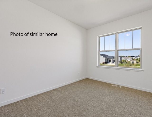 empty room with carpet flooring