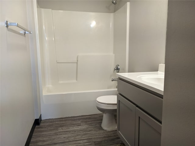 full bathroom featuring vanity, toilet, shower / bathing tub combination, and wood-type flooring