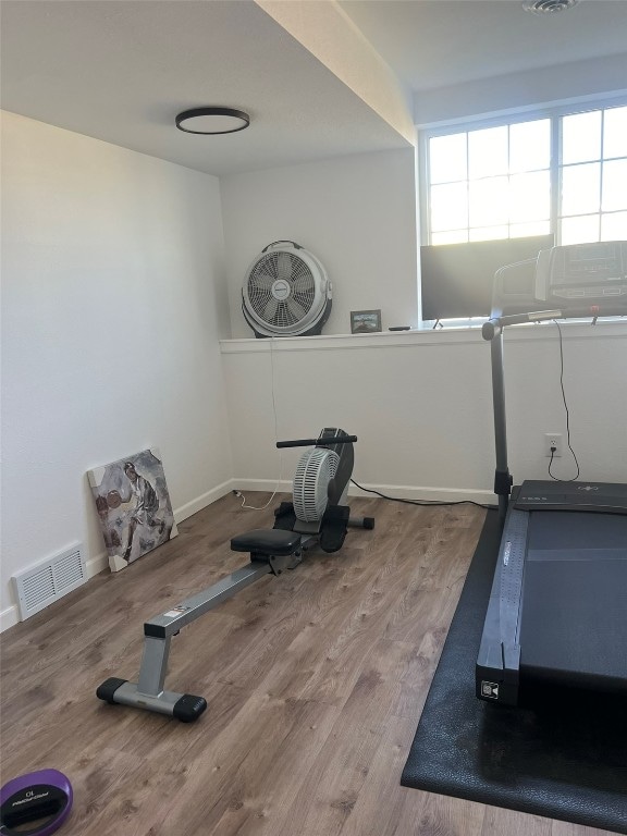 exercise area with hardwood / wood-style floors