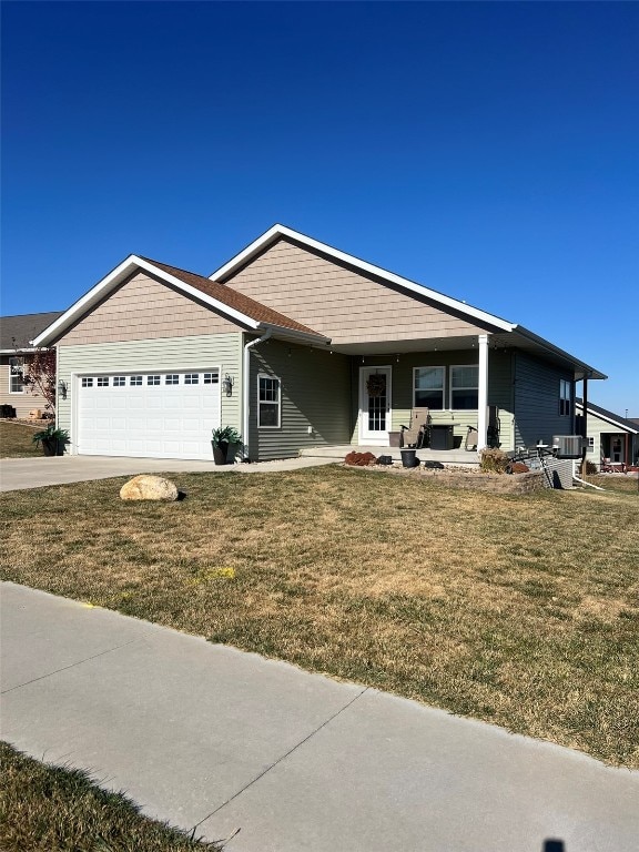 ranch-style house with a front lawn and a garage