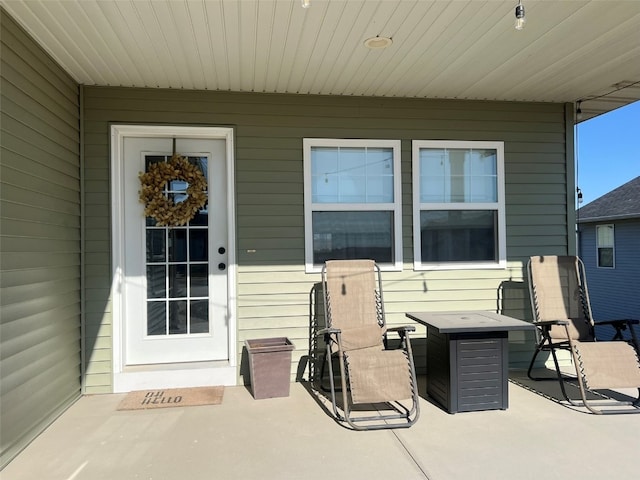 property entrance with a patio