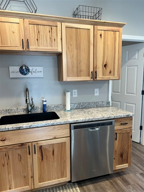 kitchen featuring light brown cabinets, light stone countertops, dishwasher, dark wood-type flooring, and sink