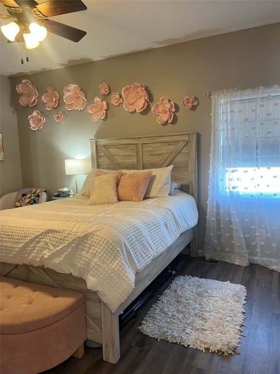 bedroom featuring dark hardwood / wood-style floors and ceiling fan