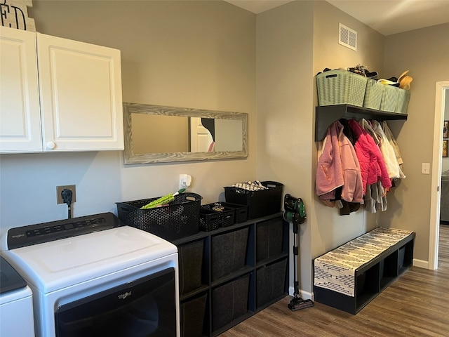 washroom with cabinets, separate washer and dryer, and dark hardwood / wood-style flooring