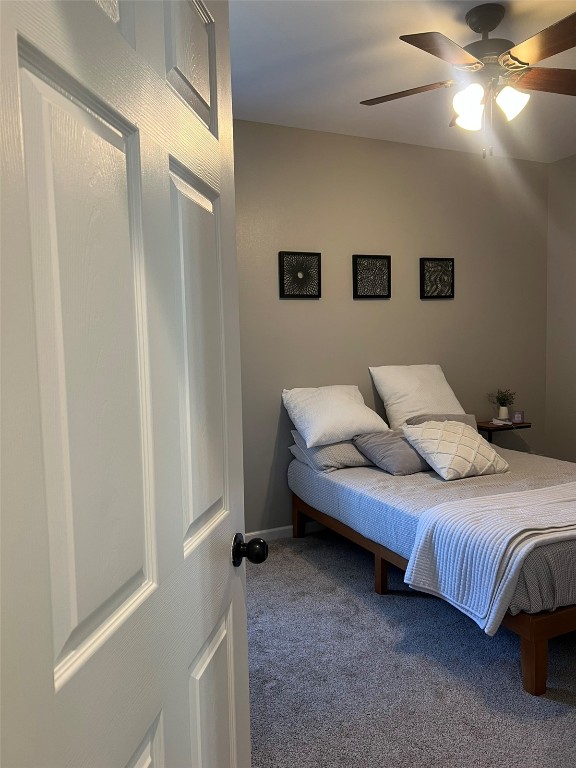 bedroom featuring ceiling fan and carpet flooring