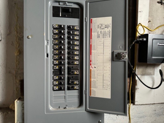 utility room featuring electric panel