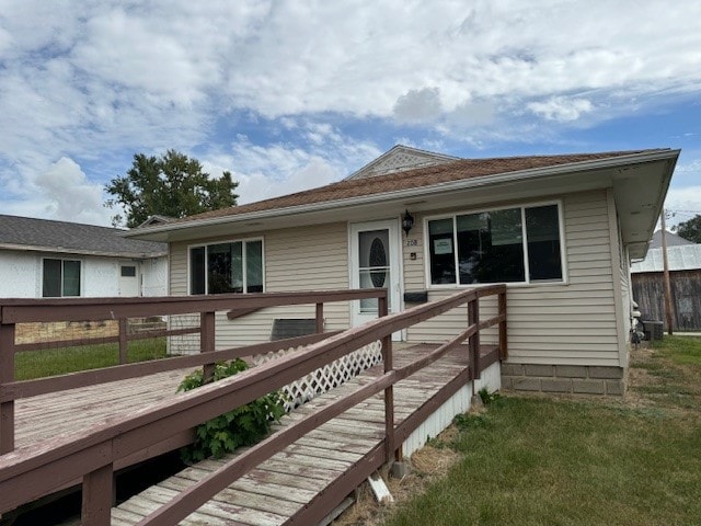 rear view of house with a wooden deck