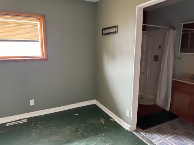 bathroom featuring walk in shower