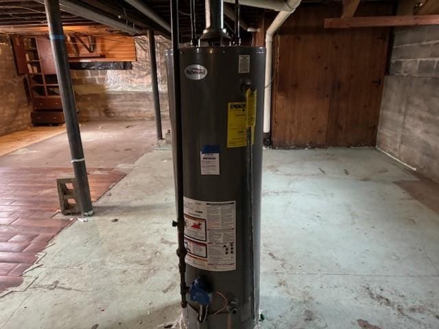 utility room featuring water heater