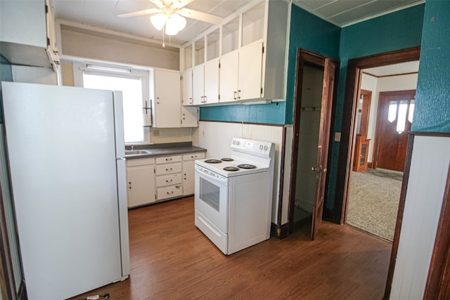 kitchen featuring white appliances, sink, hardwood / wood-style floors, ceiling fan, and white cabinets