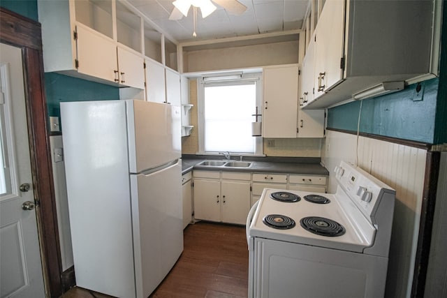 kitchen featuring dark hardwood / wood-style floors, white cabinetry, sink, and white appliances