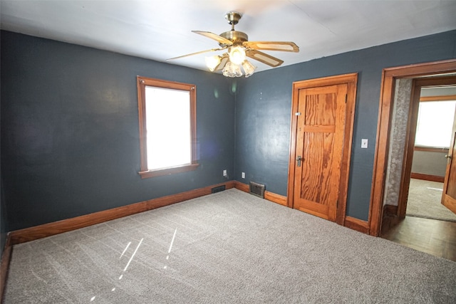 unfurnished bedroom featuring carpet and ceiling fan