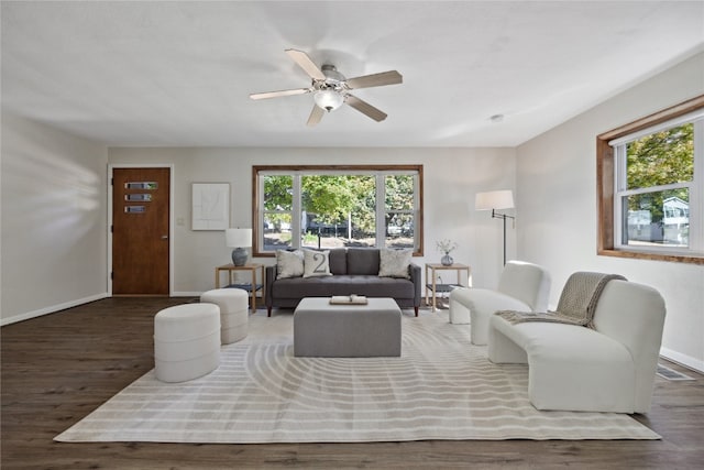 living room with ceiling fan, a healthy amount of sunlight, and dark hardwood / wood-style flooring