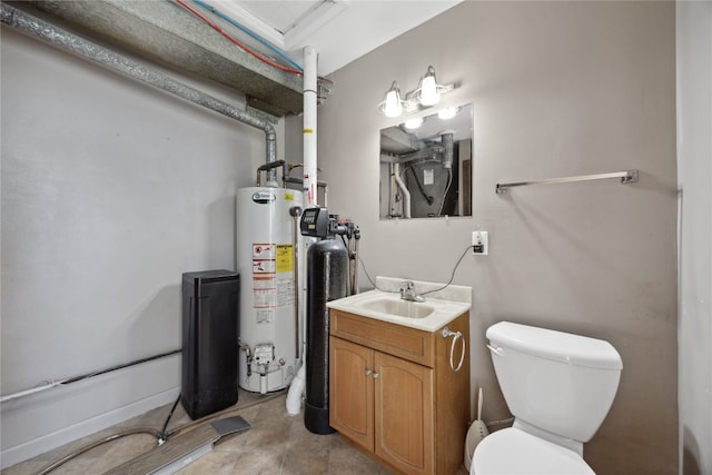 bathroom with vanity, water heater, and toilet