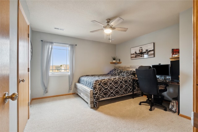 bedroom with light carpet and ceiling fan