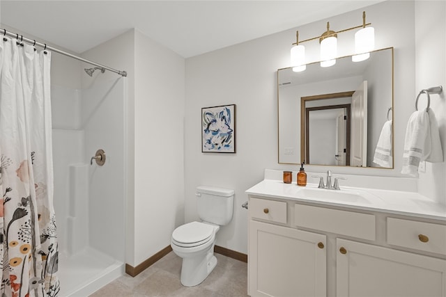 bathroom featuring vanity, toilet, and walk in shower