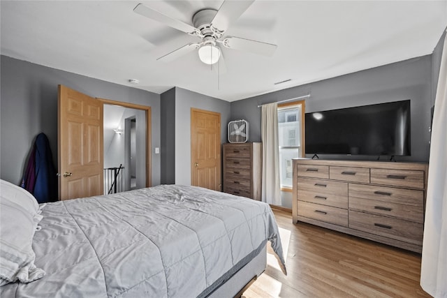 bedroom featuring ceiling fan and light hardwood / wood-style floors