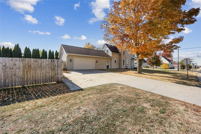 view of side of property with a garage