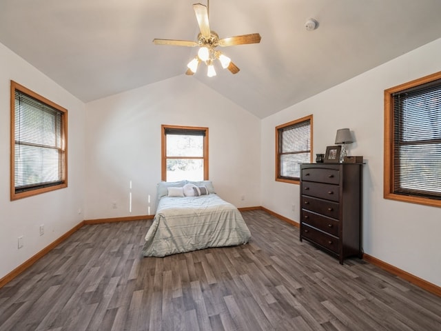 bedroom featuring lofted ceiling, dark wood-type flooring, and ceiling fan