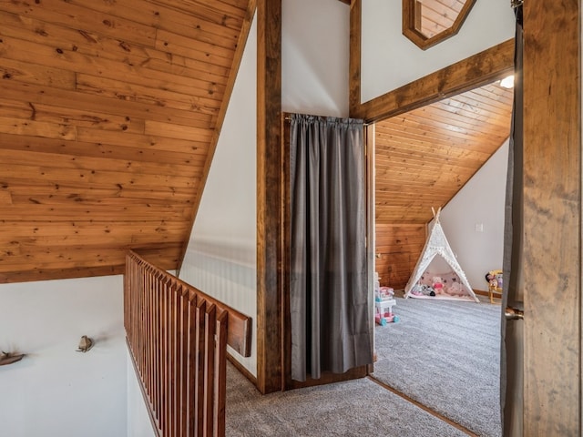 bonus room with wooden walls, vaulted ceiling, carpet flooring, and wooden ceiling