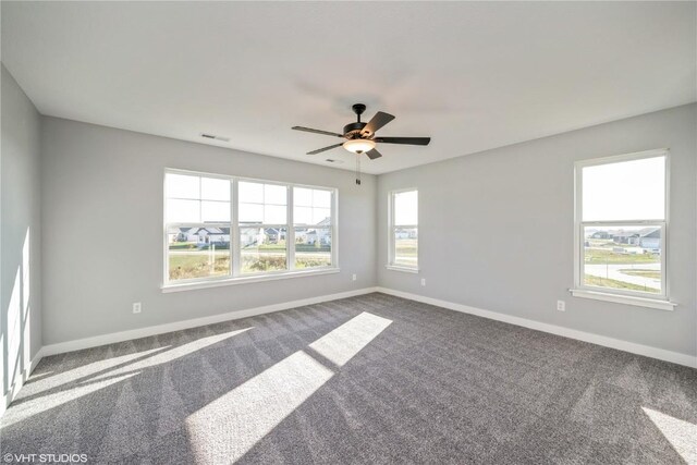 2734 Rookwood Ln, Marion, IA 52302 - unfurnished room featuring carpet floors, baseboards, and a ceiling fan