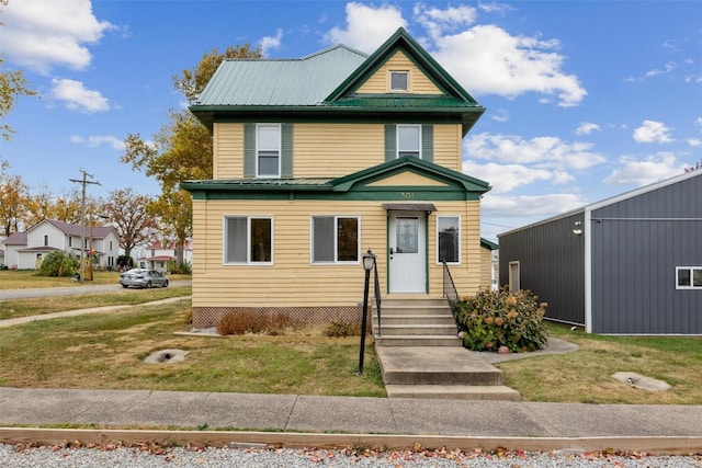 view of front facade with a front lawn