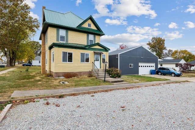 view of front of house featuring a front lawn and a garage