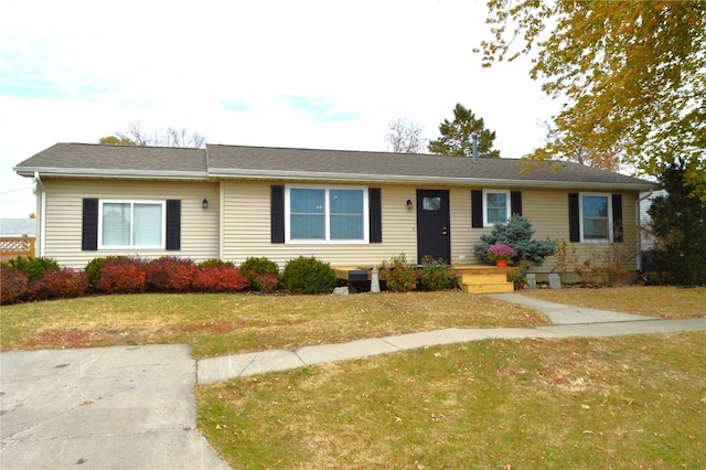 single story home with a front lawn