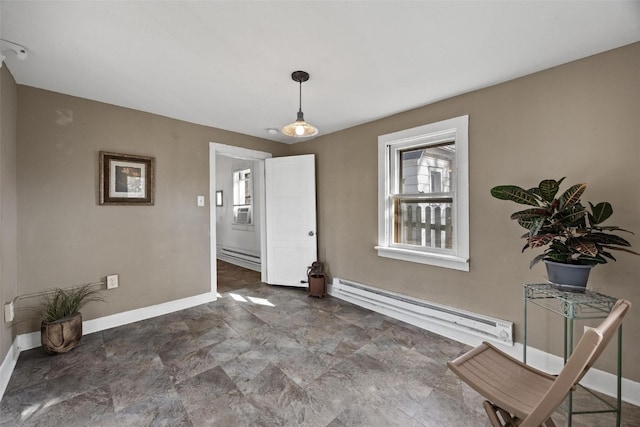 dining space featuring baseboard heating