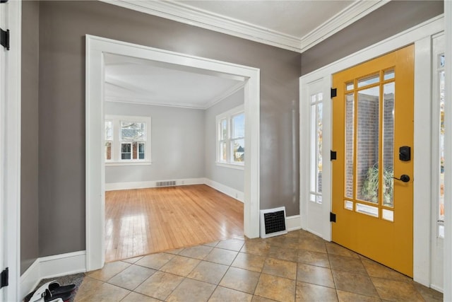 tiled entryway with crown molding