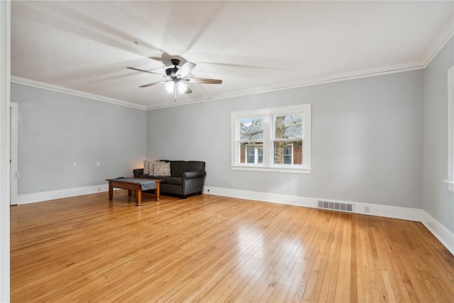 unfurnished room with ornamental molding, ceiling fan, and light hardwood / wood-style flooring