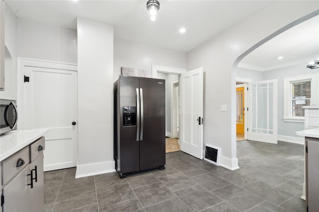 kitchen featuring white cabinetry and appliances with stainless steel finishes